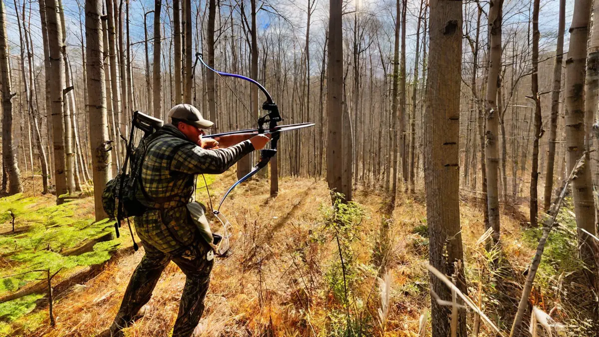 can you carry a pistol while bow hunting in michigan